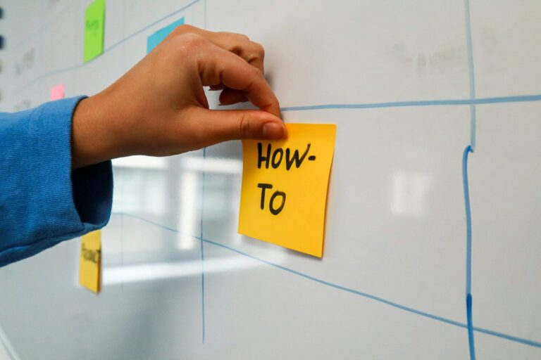 a sticky note pinned to a wall with the words how to written on How to Register a .com.ng Domain