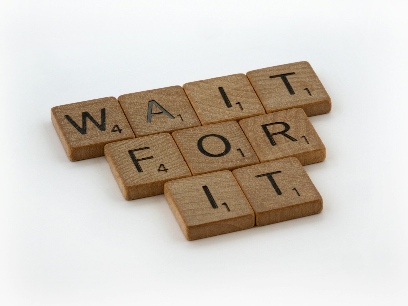 a scrabble of words that spell out wait for it